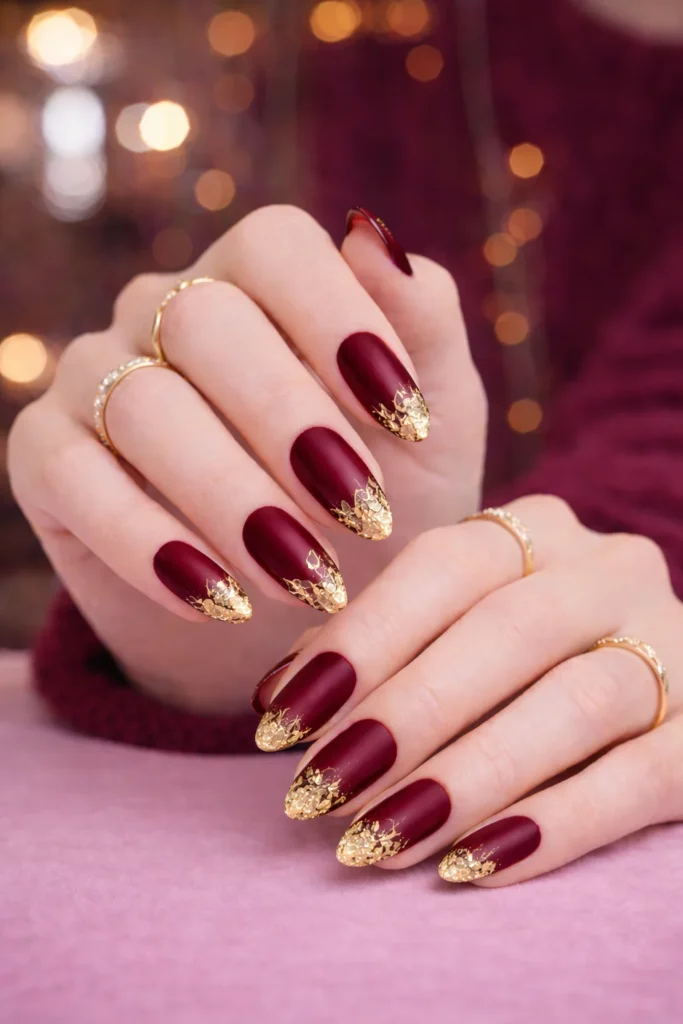 Burgundy-Nails-with-Gold-Leaf-Details.webp
